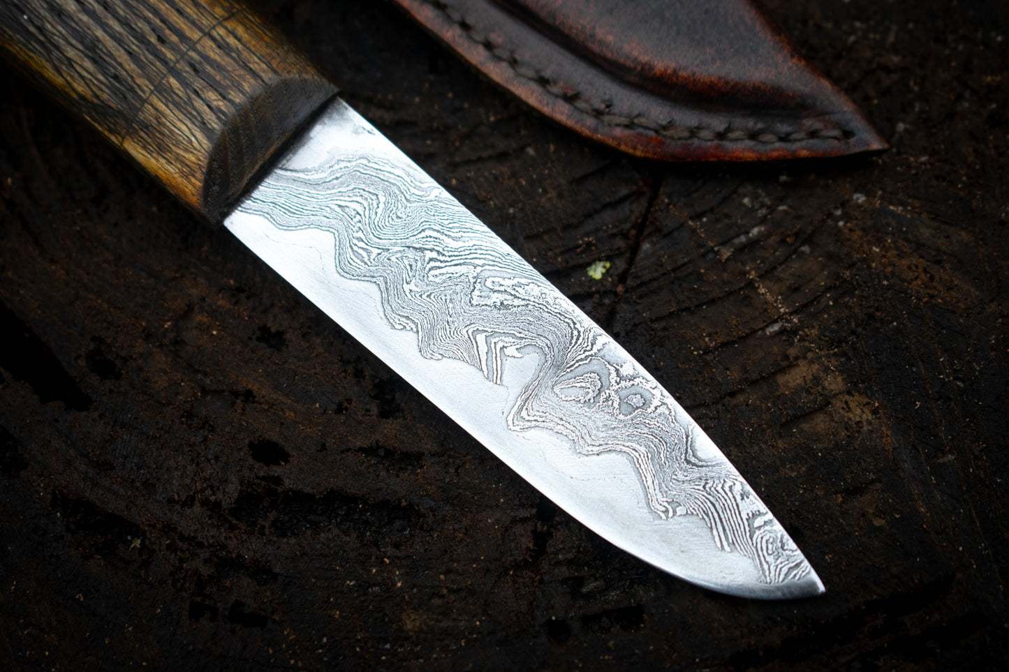 Handcrafted Bushcraft Knife with Damascus San Mai Blade and Aged Leather Sheath